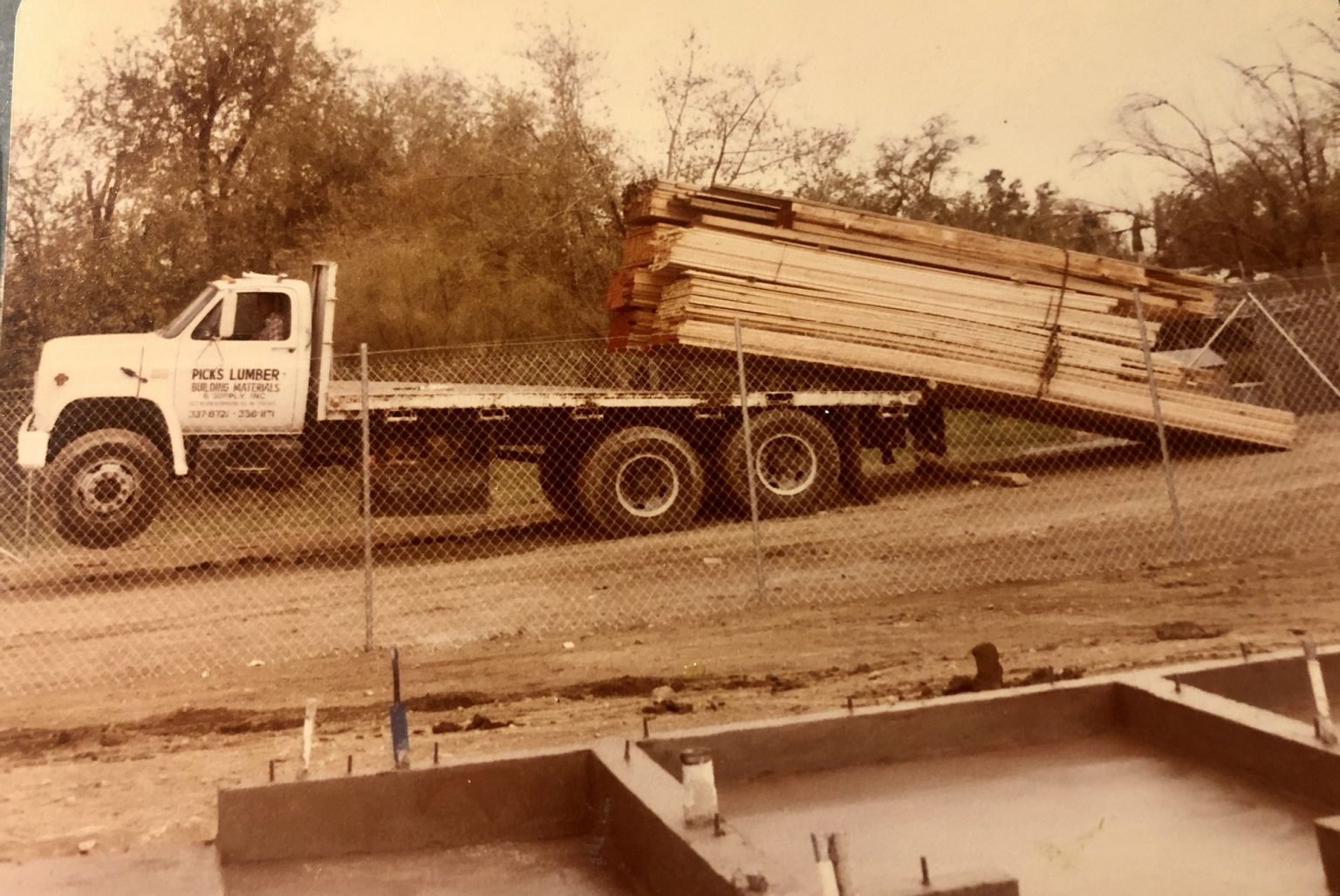 Vintage Picks Lumber delivery truck loaded with lumber